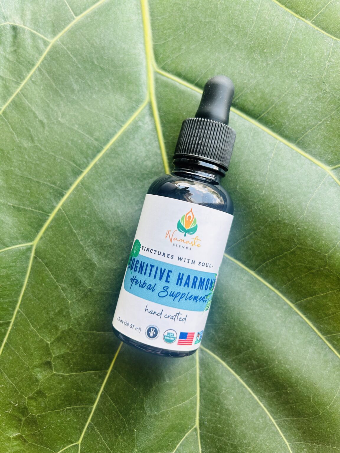 Bottle of Cognitive Harmony Herbal Supplement, formulated with mind-supporting herbs and food-grade alcohol to promote mental clarity, focus, and calm.