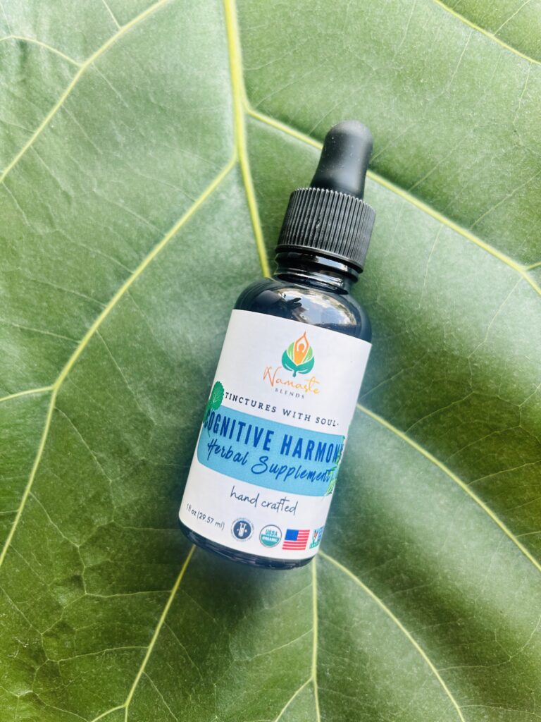 Bottle of Cognitive Harmony Herbal Supplement, formulated with mind-supporting herbs and food-grade alcohol to promote mental clarity, focus, and calm.