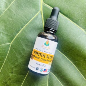 Bottle of Digestive Detox Herbal Supplement, featuring natural herbs and food-grade alcohol to support healthy digestion, gentle detoxification, and relief from bloating.
