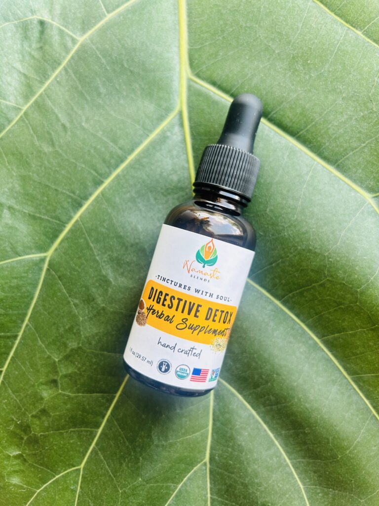 Bottle of Digestive Detox Herbal Supplement, featuring natural herbs and food-grade alcohol to support healthy digestion, gentle detoxification, and relief from bloating.