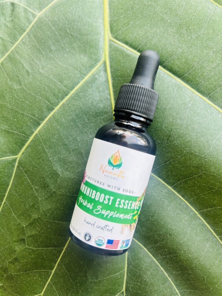 Bottle of ImmuniBoost Essence Herbal Supplement, featuring a blend of immune-supporting herbs extracted in food-grade alcohol to enhance natural defense and overall wellness.