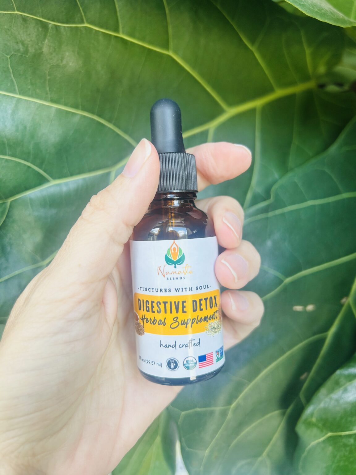 Bottle of Digestive Detox Herbal Supplement, featuring natural herbs and food-grade alcohol to support healthy digestion, gentle detoxification, and relief from bloating.