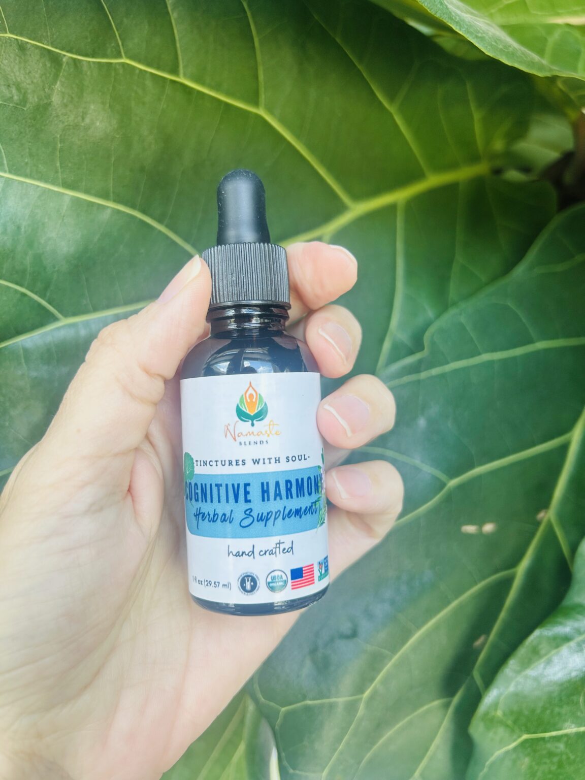 Bottle of Cognitive Harmony Herbal Supplement, formulated with mind-supporting herbs and food-grade alcohol to promote mental clarity, focus, and calm.