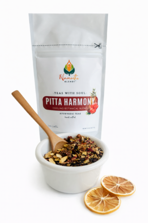 pitta harmony herbal tea bags displayed in a minimalist setting with a white mug and soft neutral tones, caffeine free herbal tea sachets with visible floral botanicals like hibiscus and rose, cooling herbal blend designed for daily wellness rituals and mindful living, cozy tea aesthetic, herbal tea for calm and balance, wellness tea gift idea, tea bags presentation for self care and refreshing routine