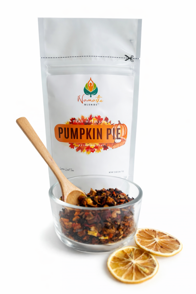 pumpkin pie herbal tea displayed in a minimalist setting with a white mug and warm neutral tones, caffeine free herbal tea with visible spices and pumpkin pieces, cozy spiced tea blend designed for daily wellness rituals and mindful living, fall tea aesthetic, herbal tea for comfort and warmth, wellness tea gift idea, tea presentation for self care and cozy lifestyle