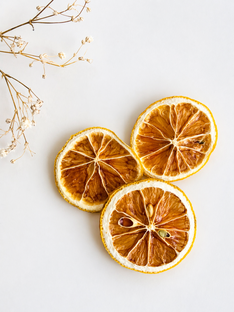 ginger turmeric herbal tea displayed in a minimalist setting with a white mug and warm neutral tones, caffeine free herbal tea with visible ginger pieces and turmeric root, warming botanical blend designed for daily wellness rituals and mindful living, cozy tea aesthetic, herbal tea for comfort and balance routine, wellness tea gift idea, tea presentation for self care and grounding daily habits