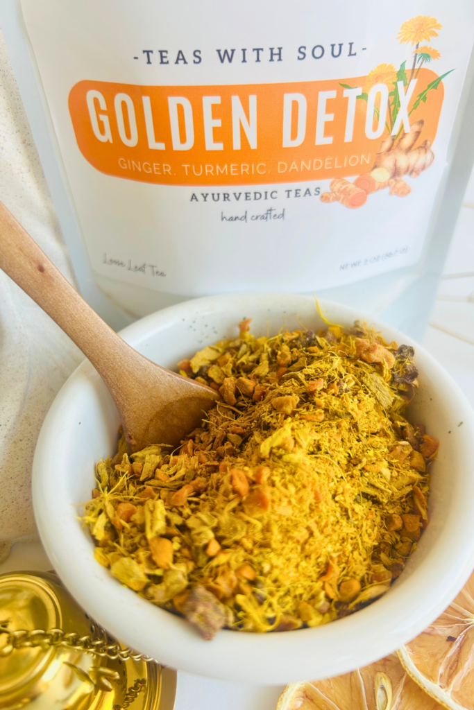 Loose leaf herbal detox tea blend with turmeric, ginger, beet, pineapple, calendula, and dandelion leaves in a botanical wellness tea designed for cozy daily rituals, digestion support, and mindful self care. Caffeine free loose leaf tea by Namaste Blends with earthy golden tones and warming ingredients.
