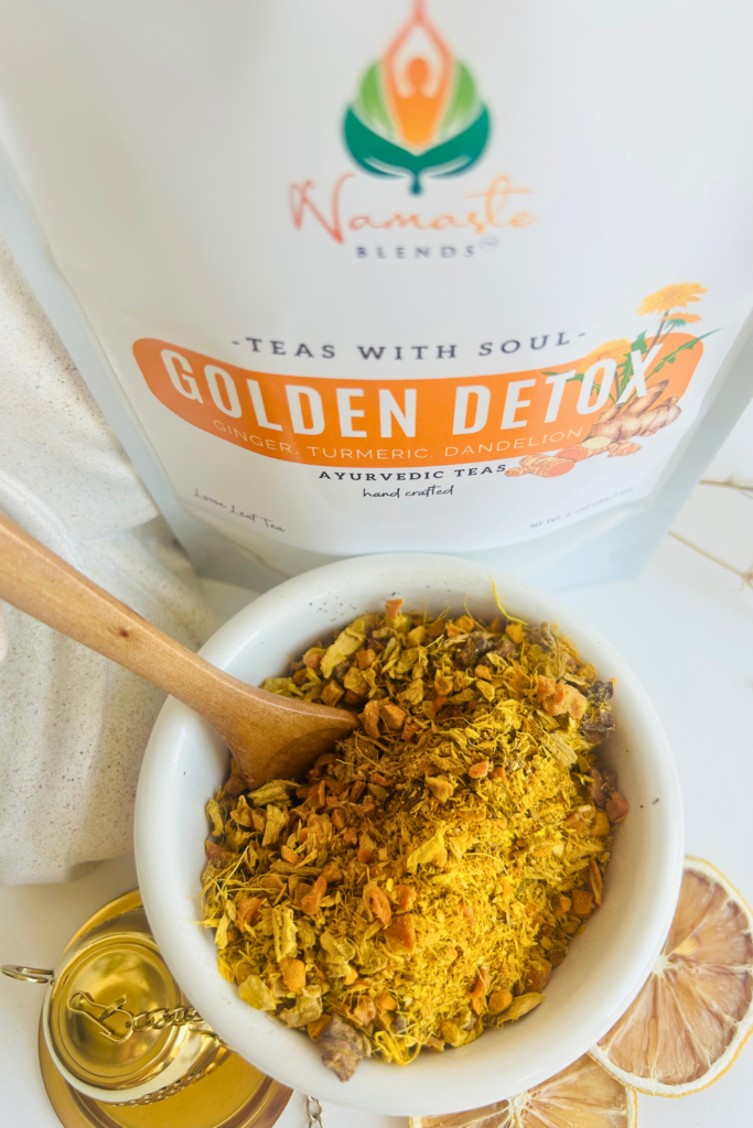 Loose leaf herbal detox tea blend with turmeric, ginger, beet, pineapple, calendula, and dandelion leaves in a botanical wellness tea designed for cozy daily rituals, digestion support, and mindful self care. Caffeine free loose leaf tea by Namaste Blends with earthy golden tones and warming ingredients.