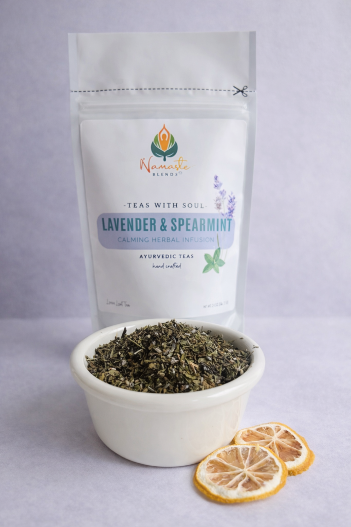 lavender spearmint herbal tea displayed in a minimalist setting with a white mug and soft neutral tones, organic caffeine free herbal tea with visible lavender buds and spearmint leaves, calming floral mint blend designed for daily wellness rituals and mindful living, cozy tea aesthetic, herbal tea for relaxation and balance, wellness tea gift idea, tea presentation for self care and peaceful lifestyle
