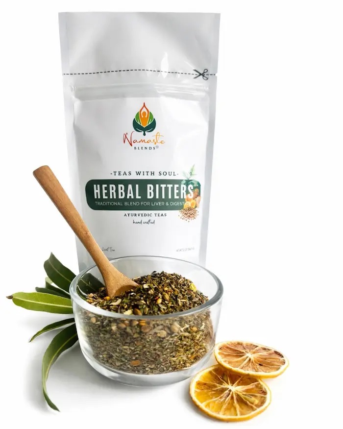 Loose leaf herbal bitters tea blend displayed in a minimalist setting with a white mug and neutral background, caffeine free herbal tea with visible dried roots and bitter botanicals designed for digestive wellness rituals, natural loose leaf tea for mindful routines and daily balance, cozy tea aesthetic, herbal tea for gut support lifestyle, wellness tea gift idea, loose leaf tea pouch presentation for self care and grounding herbal practice