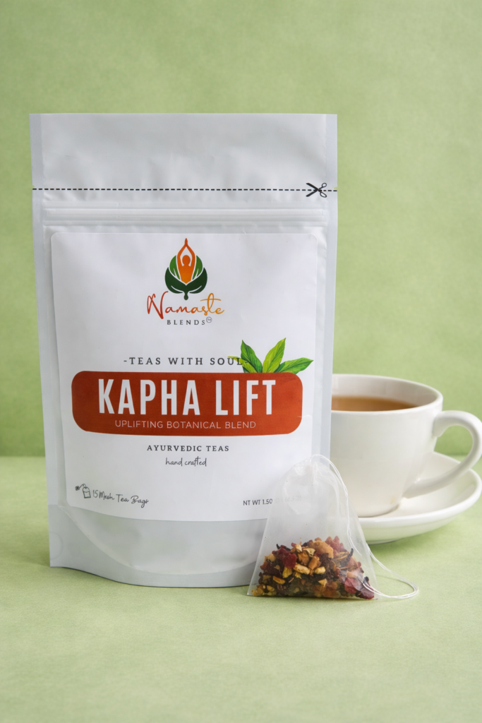 kapha lift herbal tea bags displayed in a minimalist setting with a white mug and warm neutral tones, caffeine free herbal tea sachets with visible spices like ginger clove and citrus pieces, energizing botanical blend designed for daily wellness rituals and mindful living, cozy tea aesthetic, herbal tea for energy and balance routine, wellness tea gift idea, tea bags presentation for self care and uplifting lifestyle