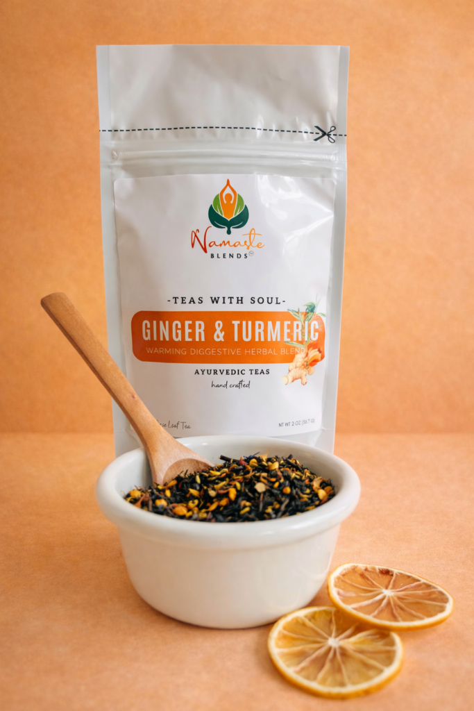ginger turmeric herbal tea displayed in a minimalist setting with a white mug and warm neutral tones, caffeine free herbal tea with visible ginger pieces and turmeric root, warming botanical blend designed for daily wellness rituals and mindful living, cozy tea aesthetic, herbal tea for comfort and balance routine, wellness tea gift idea, tea presentation for self care and grounding daily habits