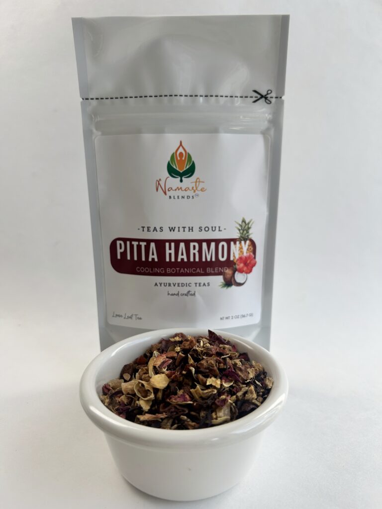 pitta harmony herbal tea bags displayed in a minimalist setting with a white mug and soft neutral tones, caffeine free herbal tea sachets with visible floral botanicals like hibiscus and rose, cooling herbal blend designed for daily wellness rituals and mindful living, cozy tea aesthetic, herbal tea for calm and balance, wellness tea gift idea, tea bags presentation for self care and refreshing routine