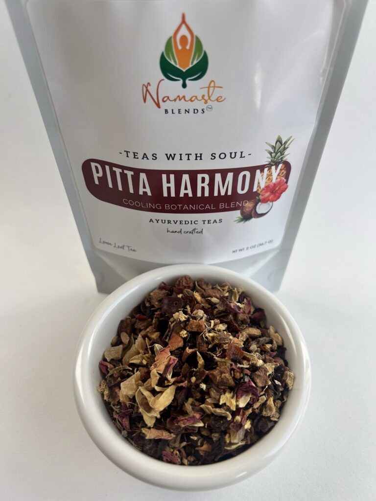 pitta harmony herbal tea bags displayed in a minimalist setting with a white mug and soft neutral tones, caffeine free herbal tea sachets with visible floral botanicals like hibiscus and rose, cooling herbal blend designed for daily wellness rituals and mindful living, cozy tea aesthetic, herbal tea for calm and balance, wellness tea gift idea, tea bags presentation for self care and refreshing routine