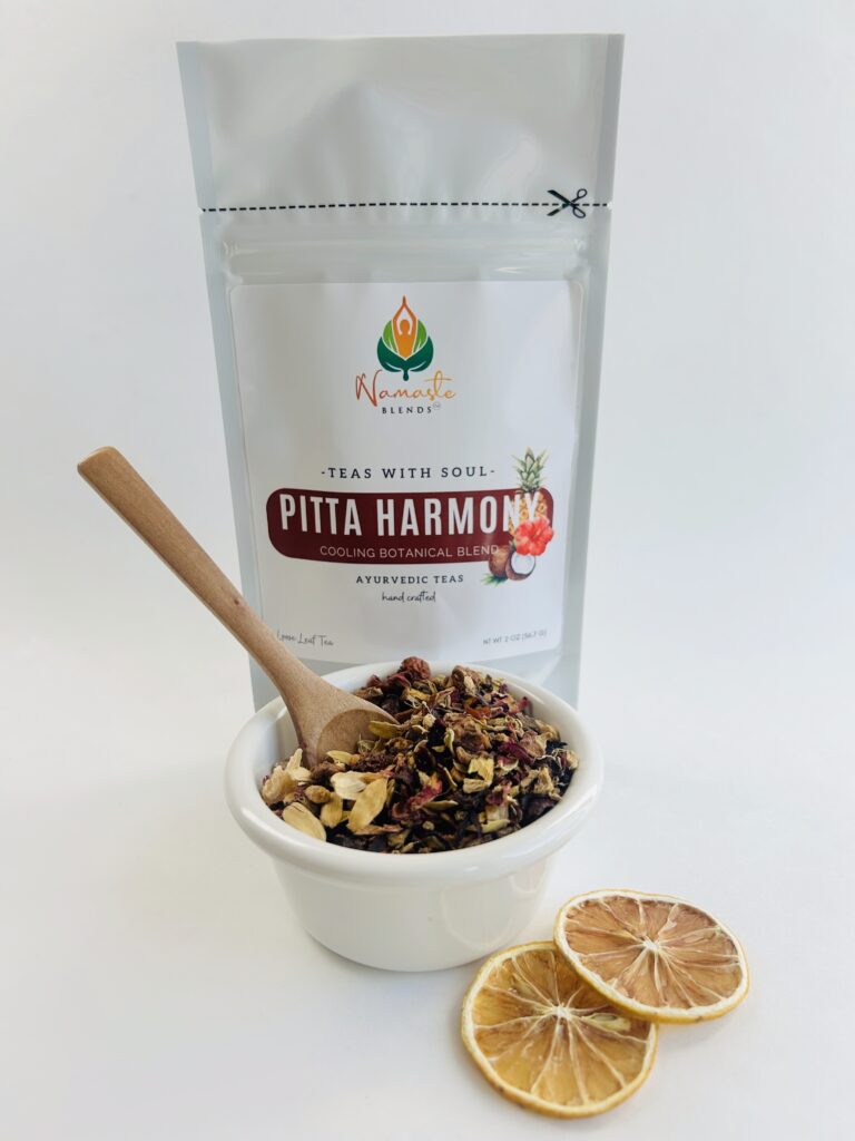 pitta harmony herbal tea bags displayed in a minimalist setting with a white mug and soft neutral tones, caffeine free herbal tea sachets with visible floral botanicals like hibiscus and rose, cooling herbal blend designed for daily wellness rituals and mindful living, cozy tea aesthetic, herbal tea for calm and balance, wellness tea gift idea, tea bags presentation for self care and refreshing routine