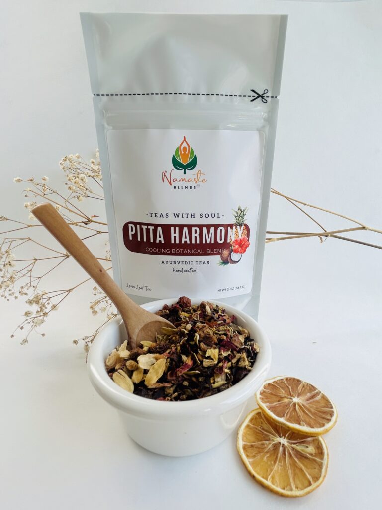 pitta harmony herbal tea bags displayed in a minimalist setting with a white mug and soft neutral tones, caffeine free herbal tea sachets with visible floral botanicals like hibiscus and rose, cooling herbal blend designed for daily wellness rituals and mindful living, cozy tea aesthetic, herbal tea for calm and balance, wellness tea gift idea, tea bags presentation for self care and refreshing routine