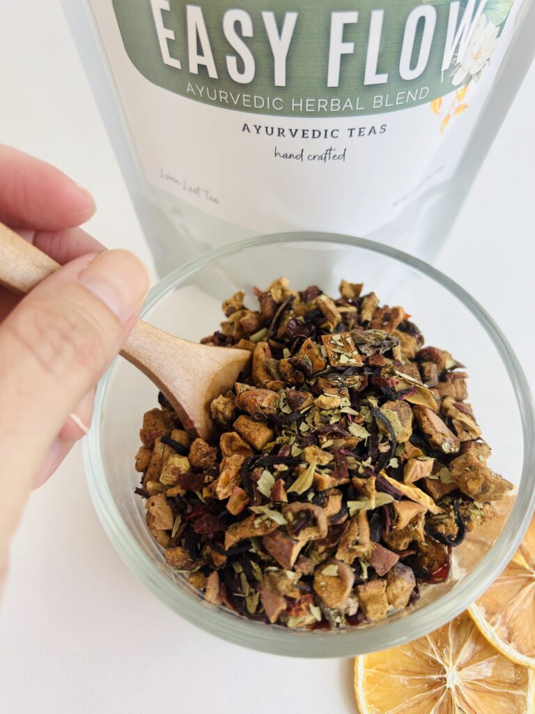 herbal tea for gentle balance displayed in a minimalist setting with a white mug and soft neutral tones, caffeine free herbal tea with visible botanicals designed for daily wellness rituals and mindful living, natural herbal tea for flow and comfort routine, cozy tea aesthetic, wellness tea for self care and balanced lifestyle, tea pouch or tea bags presentation for daily rituals