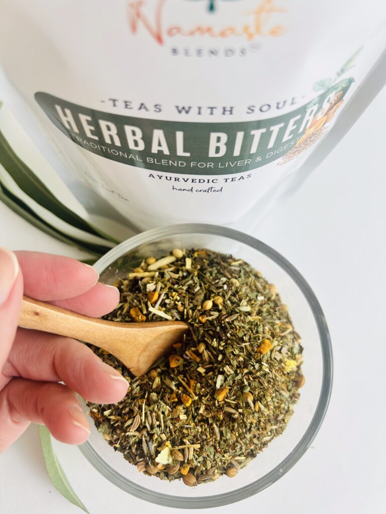 herbal bitters tea displayed in a minimalist setting with a white mug and neutral background, caffeine free herbal tea with visible dried roots and bitter botanicals, natural herbal blend designed for daily digestive wellness rituals and mindful living, cozy tea aesthetic, herbal tea for gut balance and routine support, wellness tea gift idea, tea presentation for self care and balanced lifestyle