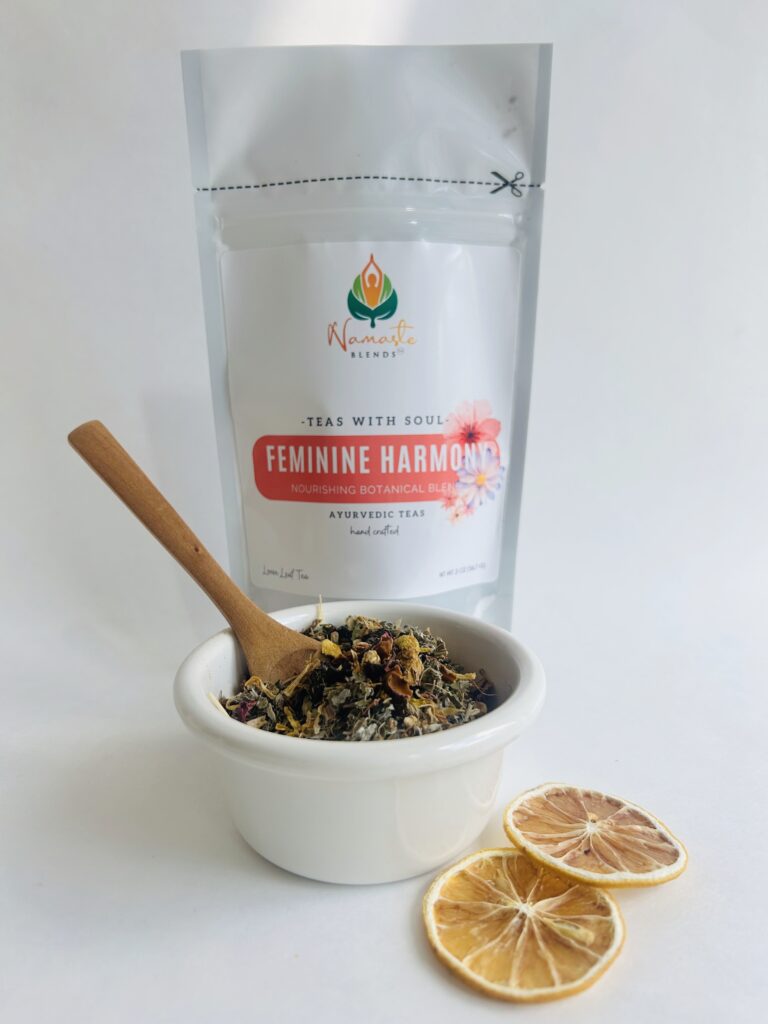 herbal tea bags for feminine balance displayed in a minimalist setting with a white mug and soft neutral tones, caffeine free herbal tea sachets with visible botanicals designed for women’s wellness rituals and mindful living, floral herbal tea for daily self care routine, cozy tea aesthetic, herbal tea for balance and comfort lifestyle, wellness tea gift for women, tea bags presentation for calm and nurturing routine