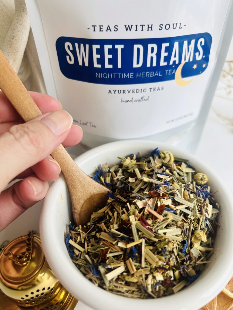 sweet dreams herbal tea bags displayed in a minimalist setting with a white mug and soft neutral tones, caffeine free herbal tea sachets with visible botanicals like chamomile and lemongrass, calming night blend designed for evening wellness rituals and mindful living, cozy tea aesthetic, herbal tea for relaxation and rest routine, wellness tea gift idea, tea bags presentation for self care and peaceful lifestyle