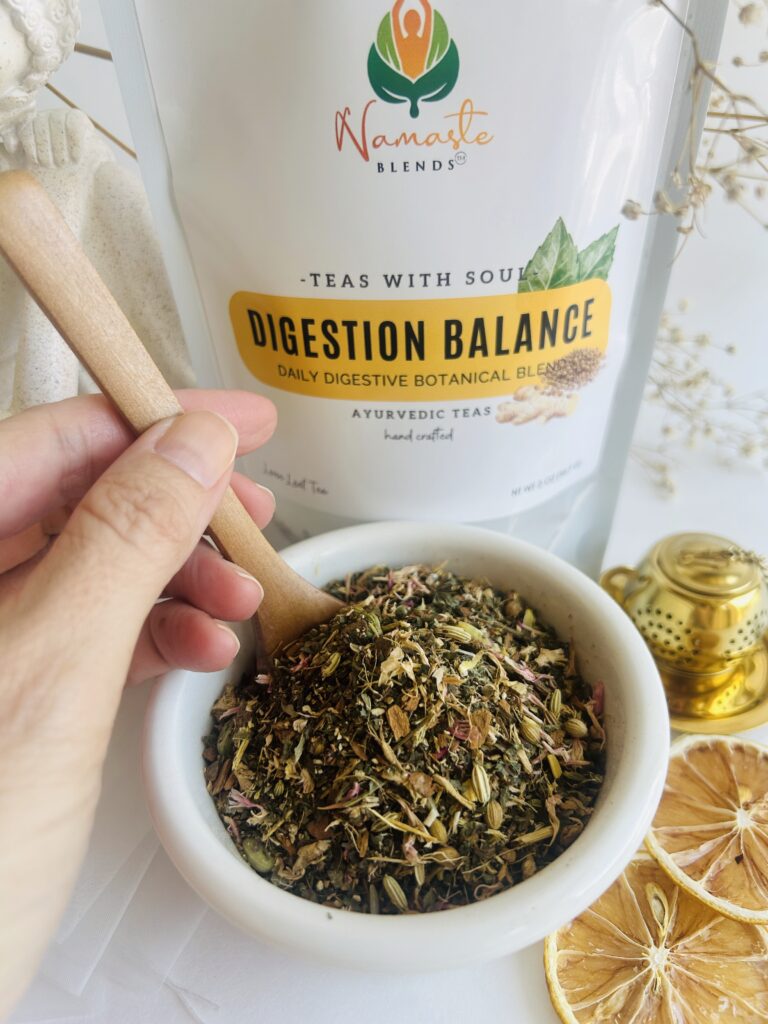loose leaf herbal tea for digestion balance displayed in a minimalist setting with a white mug and neutral background, caffeine free herbal tea with visible dried roots and botanicals designed for daily digestive wellness rituals, natural loose leaf tea blend for after meal routine and mindful living, cozy tea aesthetic, herbal tea for gut balance and gentle support, wellness tea gift idea, loose leaf tea pouch presentation for self care and balanced lifestyle