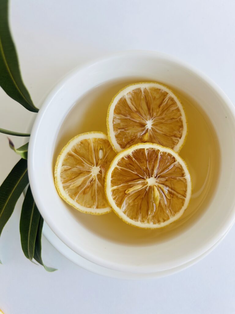 organic ccf herbal tea displayed in a minimalist setting with a white mug and neutral background, caffeine free tea with visible cumin coriander and fennel seeds, traditional ayurvedic herbal blend designed for daily digestive wellness rituals and mindful living, cozy tea aesthetic, natural herbal tea for balance and gentle routine support, wellness tea gift idea, tea presentation for self care and balanced lifestyle