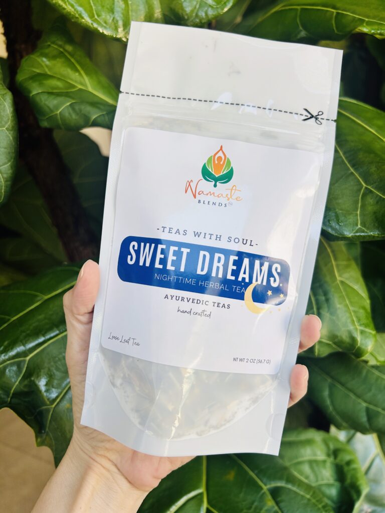 sweet dreams herbal tea bags displayed in a minimalist setting with a white mug and soft neutral tones, caffeine free herbal tea sachets with visible botanicals like chamomile and lemongrass, calming night blend designed for evening wellness rituals and mindful living, cozy tea aesthetic, herbal tea for relaxation and rest routine, wellness tea gift idea, tea bags presentation for self care and peaceful lifestyle