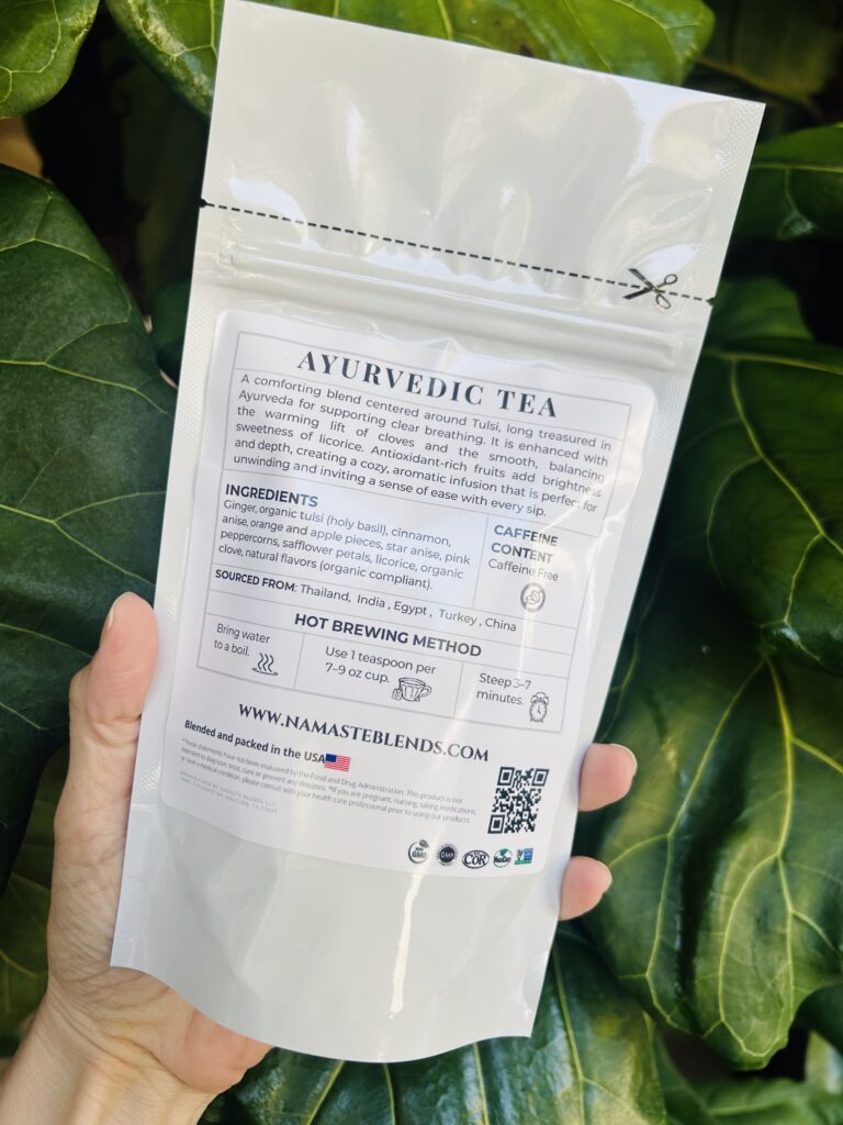 loose leaf herbal tea for cold relief displayed in a minimalist setting with a white mug and neutral background, caffeine free herbal tea with visible dried botanicals designed for soothing daily wellness rituals during seasonal changes, natural loose leaf tea blend for cozy routines and mindful living, warm tea aesthetic, herbal tea for comfort and balance, wellness tea gift idea, loose leaf tea pouch presentation for self care and seasonal lifestyle