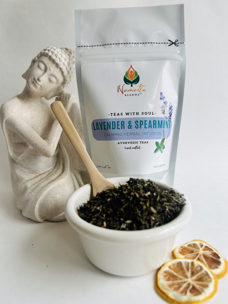 lavender spearmint herbal tea displayed in a minimalist setting with a white mug and soft neutral tones, organic caffeine free herbal tea with visible lavender buds and spearmint leaves, calming floral mint blend designed for daily wellness rituals and mindful living, cozy tea aesthetic, herbal tea for relaxation and balance, wellness tea gift idea, tea presentation for self care and peaceful lifestyle
