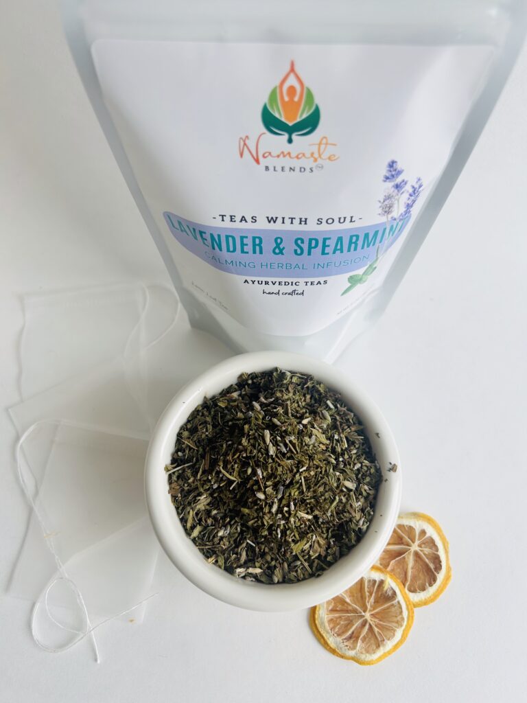 lavender spearmint herbal tea displayed in a minimalist setting with a white mug and soft neutral tones, organic caffeine free herbal tea with visible lavender buds and spearmint leaves, calming floral mint blend designed for daily wellness rituals and mindful living, cozy tea aesthetic, herbal tea for relaxation and balance, wellness tea gift idea, tea presentation for self care and peaceful lifestyle