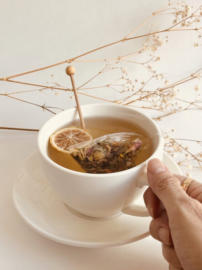 herbal tea bags for cold relief displayed in a minimalist setting with a white mug and neutral background, caffeine free herbal tea sachets with visible botanicals designed for soothing daily wellness rituals during seasonal changes, natural tea bags for cozy routines and mindful living, warm tea aesthetic, herbal tea for comfort and balance, wellness tea gift idea, tea bags presentation for self care and seasonal lifestyle