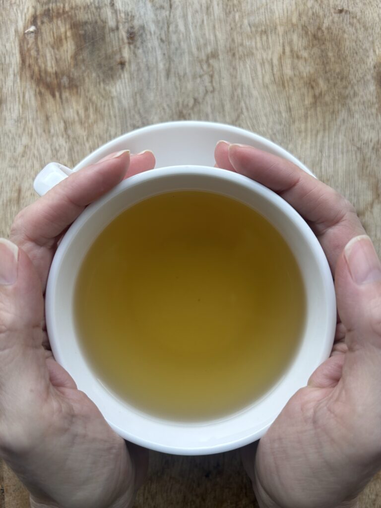herbal tea bags for digestion balance displayed in a minimalist setting with a white mug and neutral background, caffeine free herbal tea sachets with visible botanicals designed for daily digestive wellness rituals, natural tea bags for after meal routine and mindful living, cozy tea aesthetic, herbal tea for gut balance and gentle support, wellness tea gift idea, tea bags presentation for self care and balanced lifestyle