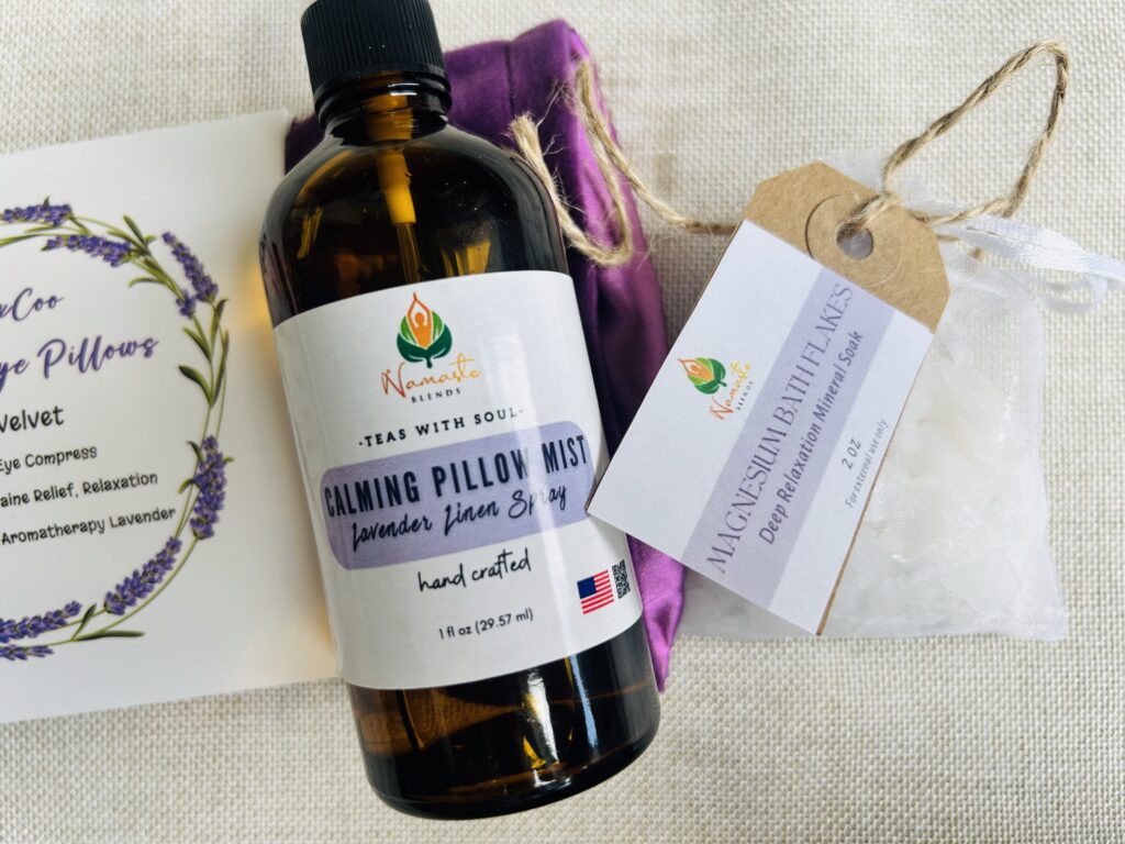 self care gift box displayed in a minimalist setting with a white mug and soft neutral tones, curated wellness set featuring herbal tea bags, lavender eye pillow, pillow mist, magnesium bath flakes and wooden spoon, calming spa gift aesthetic, relaxation gift box for stress relief and mindful living, cozy self care ritual set, wellness gift presentation for comfort and peaceful lifestyle