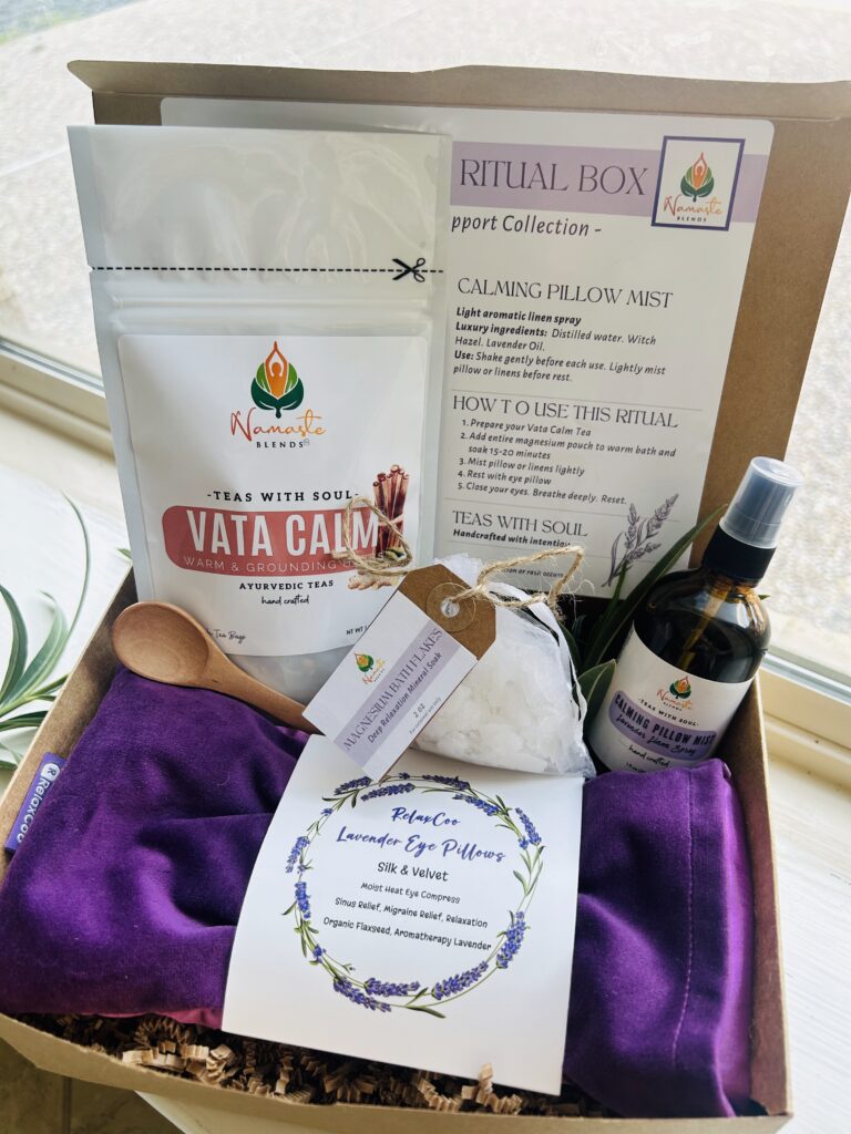 self care gift box displayed in a minimalist setting with a white mug and soft neutral tones, curated wellness set featuring herbal tea bags, lavender eye pillow, pillow mist, magnesium bath flakes and wooden spoon, calming spa gift aesthetic, relaxation gift box for stress relief and mindful living, cozy self care ritual set, wellness gift presentation for comfort and peaceful lifestyle