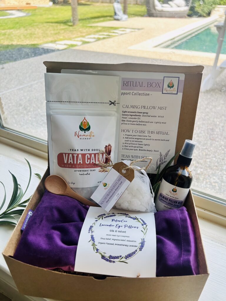 self care gift box displayed in a minimalist setting with a white mug and soft neutral tones, curated wellness set featuring herbal tea bags, lavender eye pillow, pillow mist, magnesium bath flakes and wooden spoon, calming spa gift aesthetic, relaxation gift box for stress relief and mindful living, cozy self care ritual set, wellness gift presentation for comfort and peaceful lifestyle
