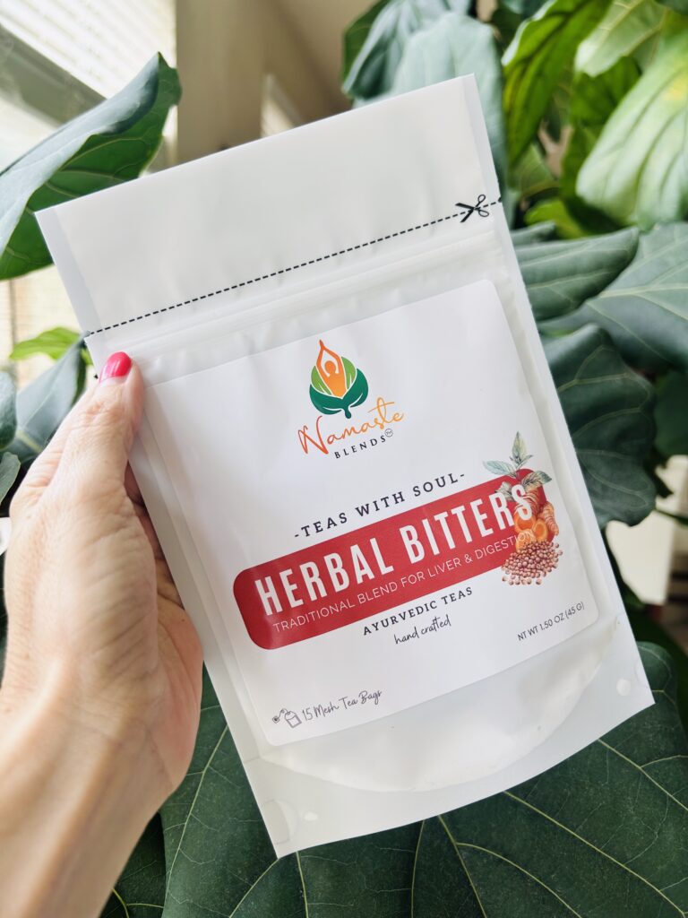 herbal bitters tea displayed in a minimalist setting with a white mug and neutral background, caffeine free herbal tea with visible dried roots and bitter botanicals, natural herbal blend designed for daily digestive wellness rituals and mindful living, cozy tea aesthetic, herbal tea for gut balance and routine support, wellness tea gift idea, tea presentation for self care and balanced lifestyle