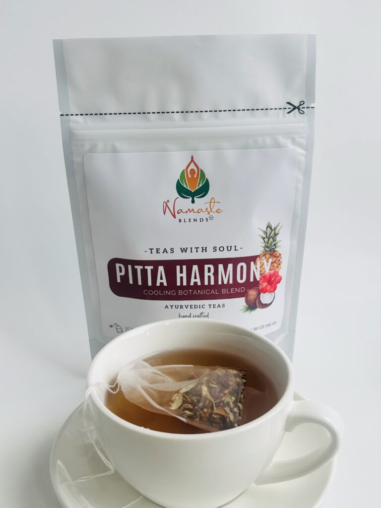 pitta harmony herbal tea bags displayed in a minimalist setting with a white mug and soft neutral tones, caffeine free herbal tea sachets with visible floral botanicals like hibiscus and rose, cooling herbal blend designed for daily wellness rituals and mindful living, cozy tea aesthetic, herbal tea for calm and balance, wellness tea gift idea, tea bags presentation for self care and refreshing routine