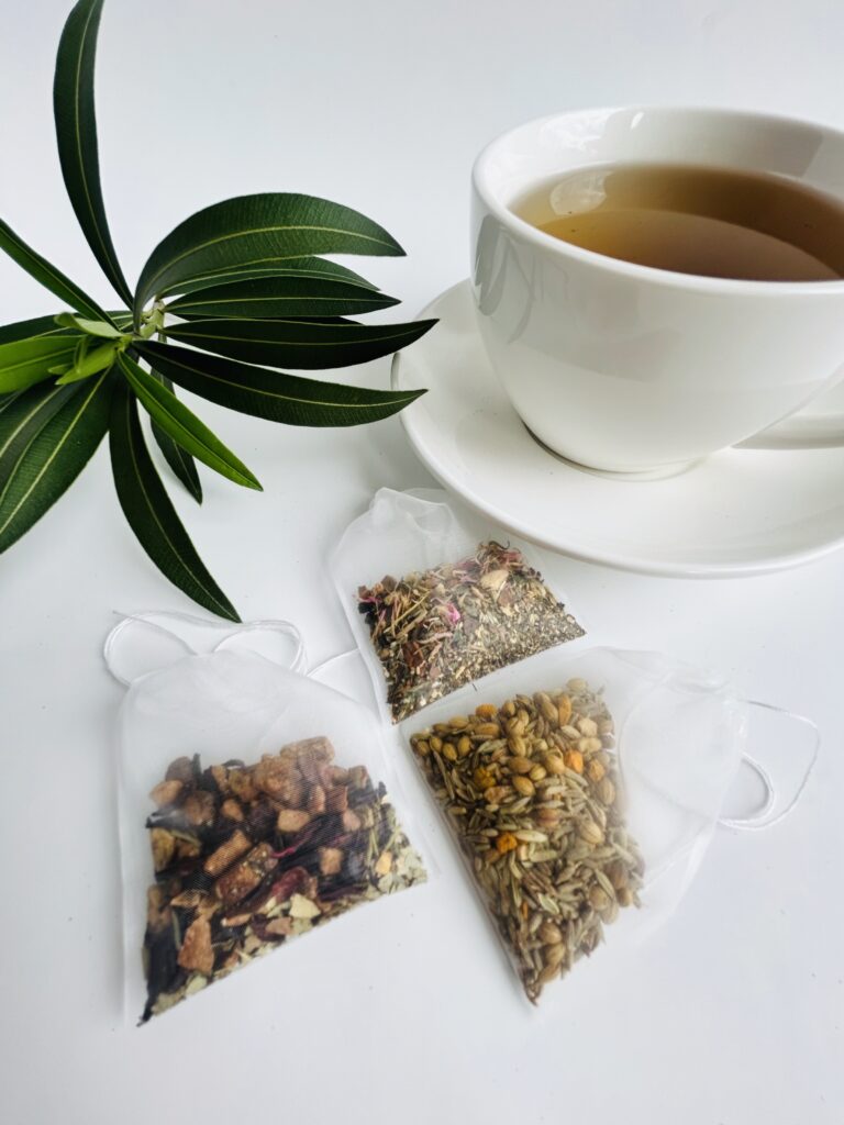 herbal tea bags for digestion balance displayed in a minimalist setting with a white mug and neutral background, caffeine free herbal tea sachets with visible botanicals designed for daily digestive wellness rituals, natural tea bags for after meal routine and mindful living, cozy tea aesthetic, herbal tea for gut balance and gentle support, wellness tea gift idea, tea bags presentation for self care and balanced lifestyle