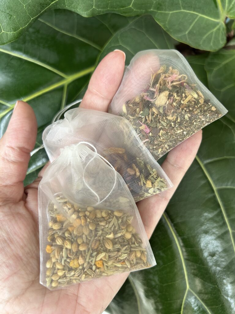 herbal tea bags for digestion balance displayed in a minimalist setting with a white mug and neutral background, caffeine free herbal tea sachets with visible botanicals designed for daily digestive wellness rituals, natural tea bags for after meal routine and mindful living, cozy tea aesthetic, herbal tea for gut balance and gentle support, wellness tea gift idea, tea bags presentation for self care and balanced lifestyle