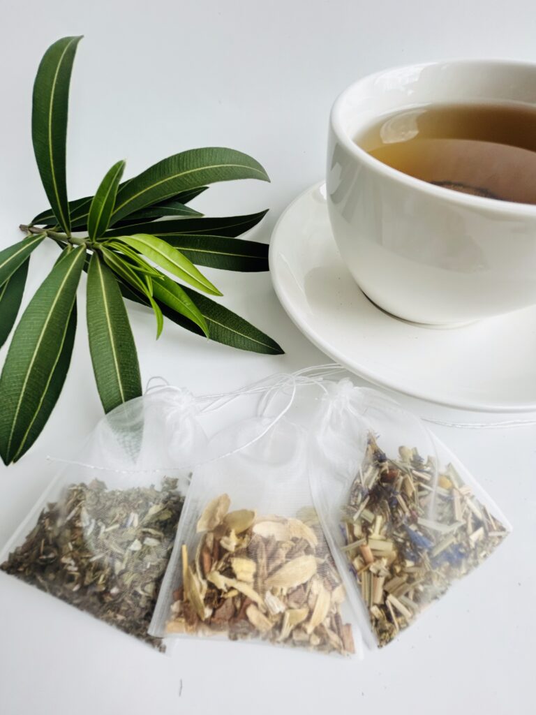lavender spearmint herbal tea displayed in a minimalist setting with a white mug and soft neutral tones, organic caffeine free herbal tea with visible lavender buds and spearmint leaves, calming floral mint blend designed for daily wellness rituals and mindful living, cozy tea aesthetic, herbal tea for relaxation and balance, wellness tea gift idea, tea presentation for self care and peaceful lifestyle