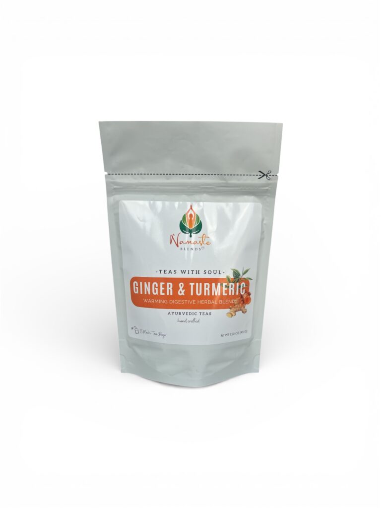 ginger turmeric herbal tea displayed in a minimalist setting with a white mug and warm neutral tones, caffeine free herbal tea with visible ginger pieces and turmeric root, warming botanical blend designed for daily wellness rituals and mindful living, cozy tea aesthetic, herbal tea for comfort and balance routine, wellness tea gift idea, tea presentation for self care and grounding daily habits
