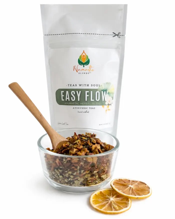 Loose leaf herbal tea for gentle feminine balance displayed in a minimalist setting with a white mug and soft neutral tones, caffeine free herbal tea with visible dried botanicals designed for monthly wellness rituals and mindful self care, soothing loose leaf tea blend for comfort and relaxation routine, cozy tea aesthetic, herbal tea for balanced lifestyle, wellness tea gift for women, loose leaf tea pouch presentation for calm and nurturing daily habits