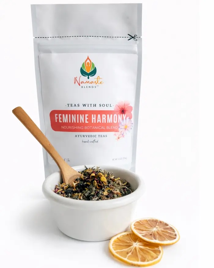 Loose leaf herbal tea for feminine balance displayed in a minimalist setting with a white mug and soft neutral tones, caffeine free herbal tea with visible dried botanicals designed for women’s daily wellness rituals, floral loose leaf tea blend for mindful self care and gentle routine support, cozy tea aesthetic, herbal tea for relaxation and balance lifestyle, wellness tea gift for women, loose leaf tea pouch presentation for calm and nurturing daily habits