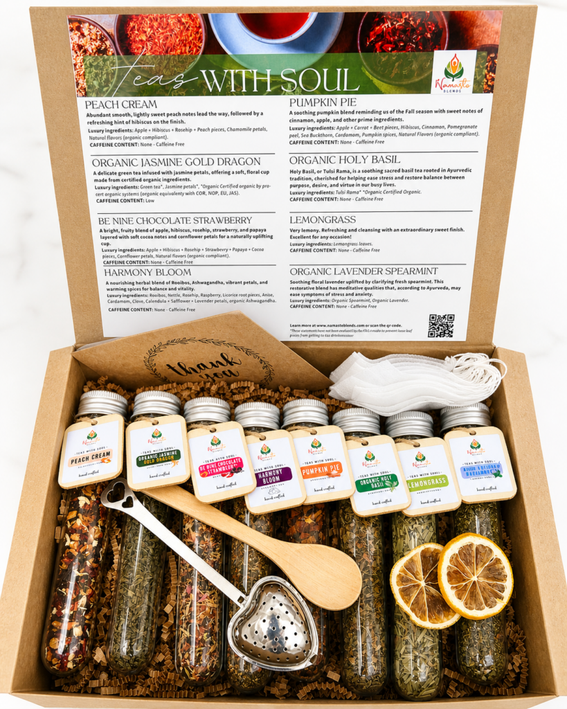 An elegant Tea Sampler Gift Box displayed on a wooden table, featuring a variety of neatly arranged herbal tea blends in individual packaging. The box includes labels showcasing flavors like chamomile, mint, and turmeric ginger, with a warm and inviting aesthetic. A teacup filled with steaming tea is placed beside the box, surrounded by loose tea leaves and a sprig of fresh herbs, evoking a sense of relaxation and wellness.