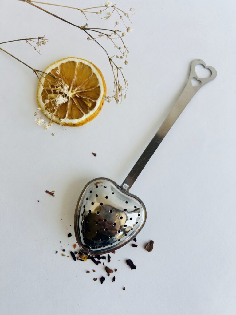 heart tea infuser stainless steel loose leaf tea strainer reusable tea tool cute tea accessory for mug loose leaf brewing cozy tea ritual tea lover gift simple tea accessory small tea strainer durable metal infuser aesthetic tea tool minimalist tea setup warm tea moment daily tea ritual accessory