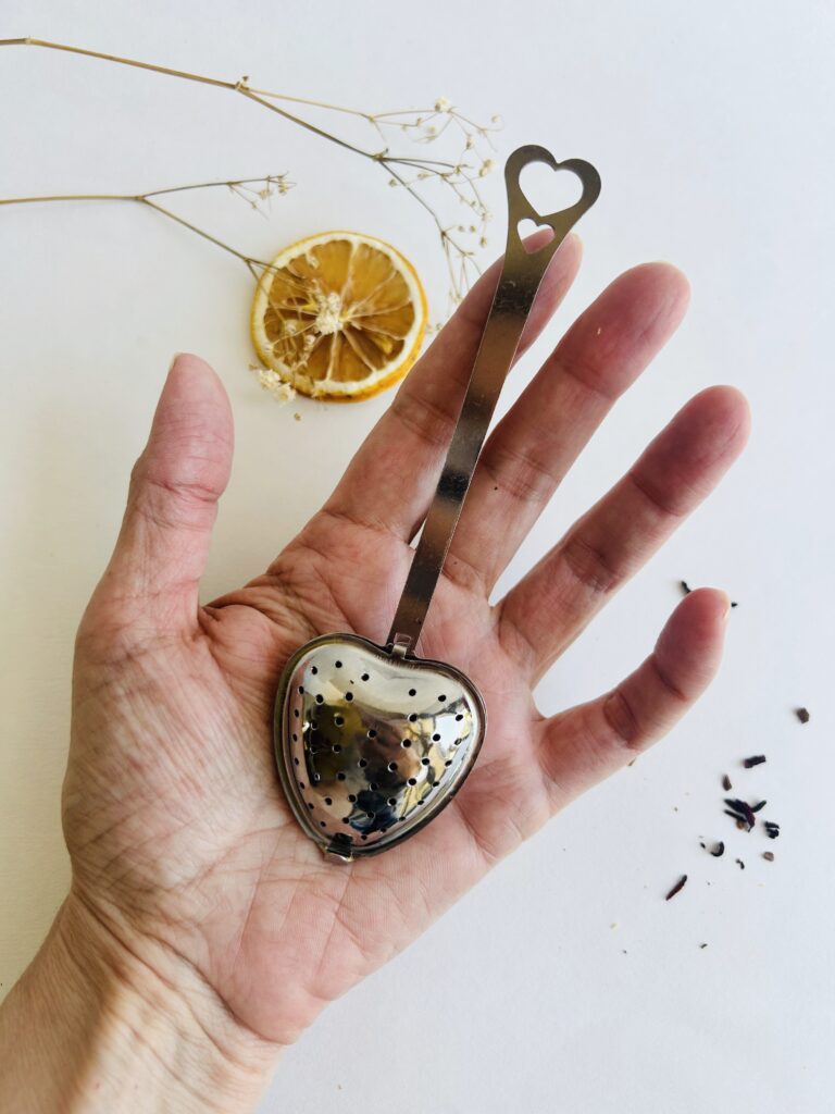 heart tea infuser stainless steel loose leaf tea strainer reusable tea tool cute tea accessory for mug loose leaf brewing cozy tea ritual tea lover gift simple tea accessory small tea strainer durable metal infuser aesthetic tea tool minimalist tea setup warm tea moment daily tea ritual accessory