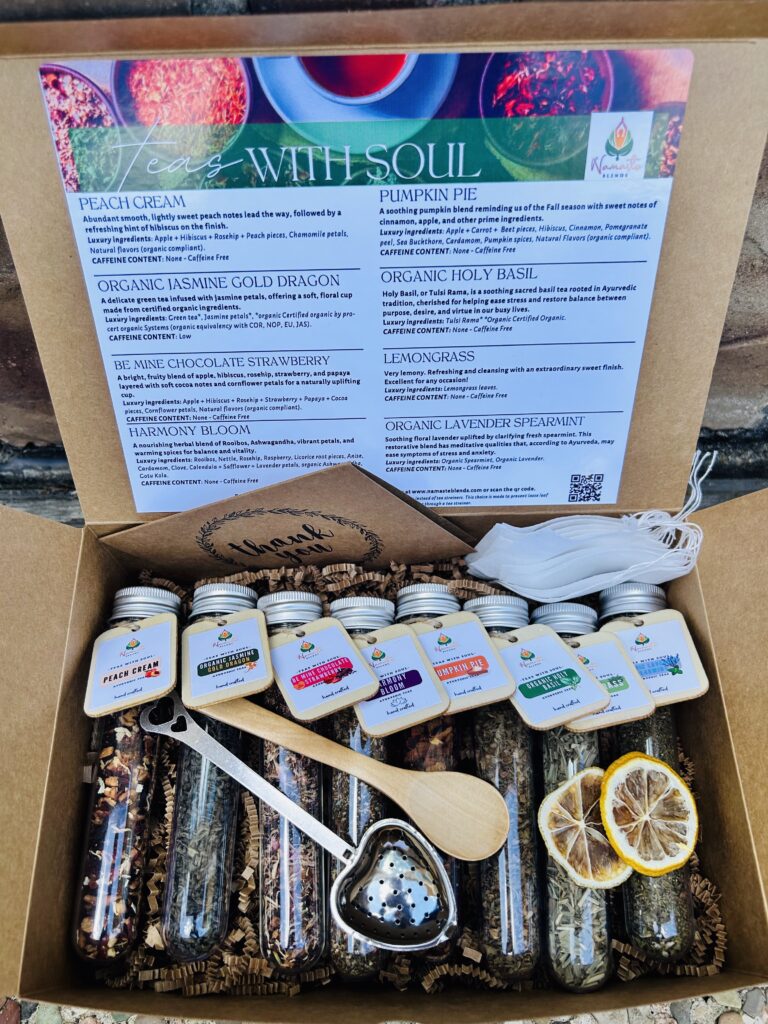 Loose leaf herbal tea gift box displayed in a minimalist setting with a white mug and neutral background, curated wellness set featuring loose leaf tea blends with visible botanicals, tea essentials such as honey sticks and dried citrus slices, cozy tea ritual aesthetic, tea gift box for self care and mindful living, premium loose leaf tea set presentation for gifting and balanced lifestyle