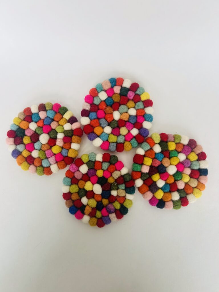 floral felt ball coasters soft pom pom coasters set of 4 colorful flower coaster set tea cup coaster cozy tea setup table decor tea accessory soft coaster set for mugs handmade style coaster aesthetic tea ritual decor home decor tea lovers gift soft felt coaster set