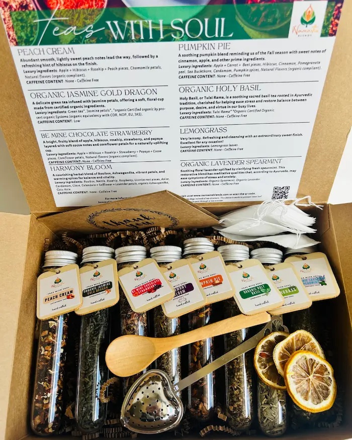 Loose leaf herbal tea gift box displayed in a minimalist setting with a white mug and neutral background, curated wellness set featuring loose leaf tea blends with visible botanicals, tea essentials such as honey sticks and dried citrus slices, cozy tea ritual aesthetic, tea gift box for self care and mindful living, premium loose leaf tea set presentation for gifting and balanced lifestyle