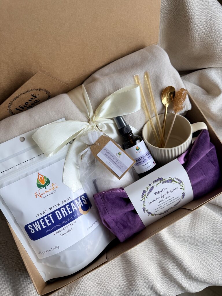 The Sweet Dreams Ritual Box is a luxurious bedtime gift designed to inspire peaceful evenings and comforting self-care rituals. Featuring our handcrafted Sweet Dreams Herbal Tea, a soft throw blanket, lavender eye pillow, magnesium bath flakes, calming pillow mist, ceramic tea mug, gold spoon, honey stick, and sugar stick, this beautifully curated collection creates the perfect nighttime tea experience. This premium gift set includes 15 food-grade mesh tea bags filled with our naturally caffeine-free botanical blend, handcrafted in small batches by Namaste Blends. Beautifully packaged and ready to gift, it's the perfect choice for birthdays, Mother's Day, holidays, thank-you gifts, or anyone who enjoys cozy evenings, botanical teas, and intentional bedtime rituals.